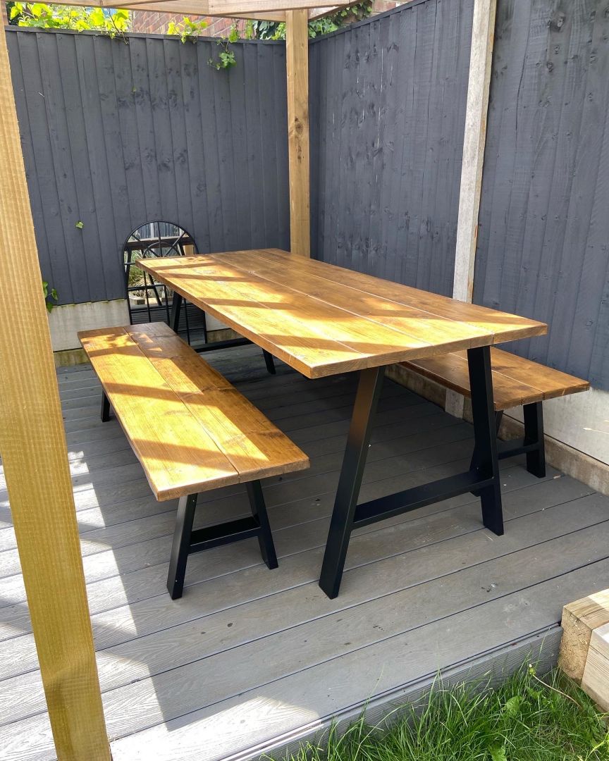 Handcrafted outdoor dining table made from reclaimed scaffold boards