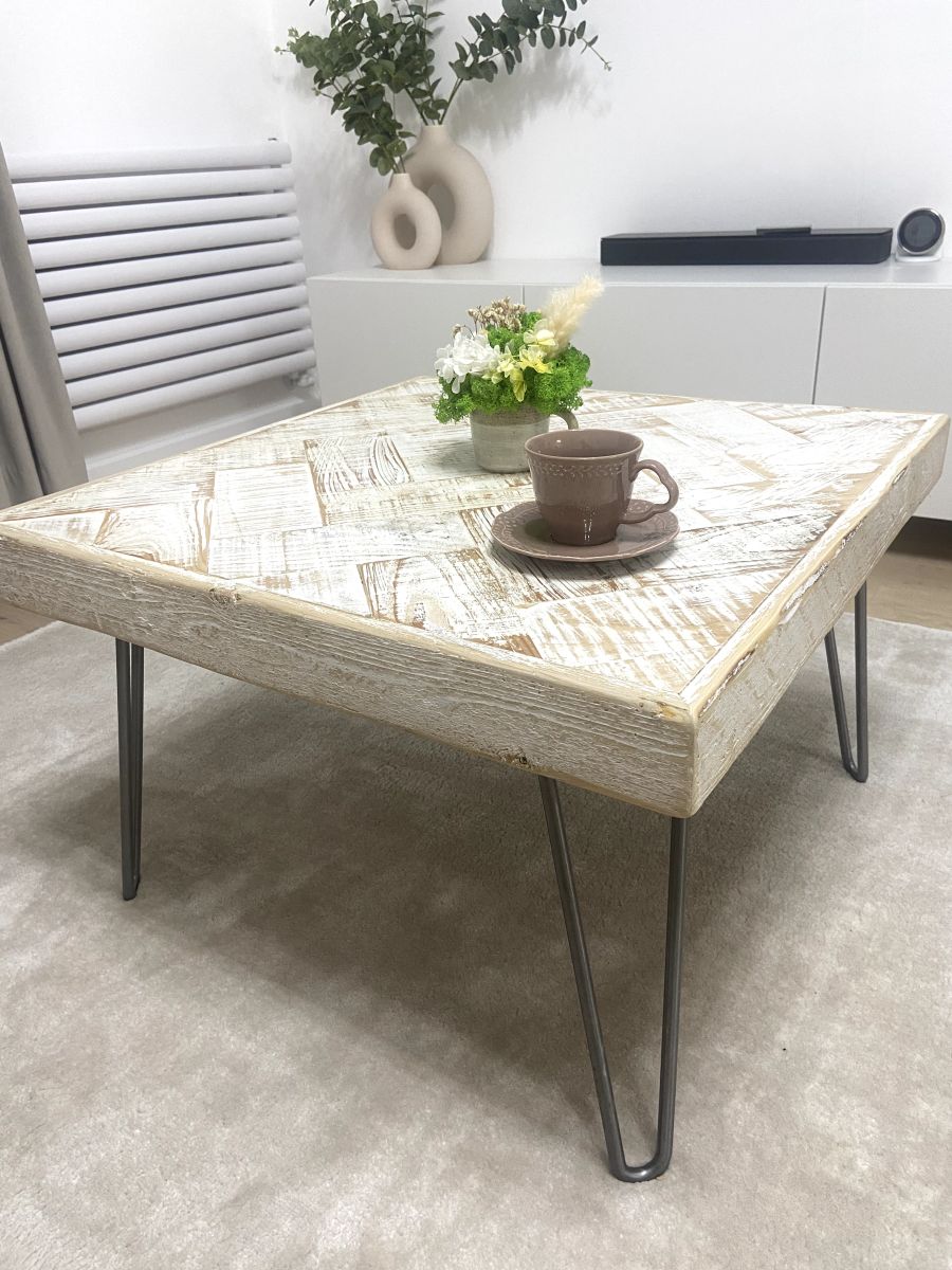 Handmade double herringbone coffee table with distressed reclaimed wood top and metal legs – rustic and bold living room centerpiece