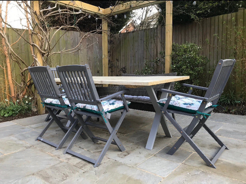 Handcrafted outdoor dining table made from reclaimed scaffold boards