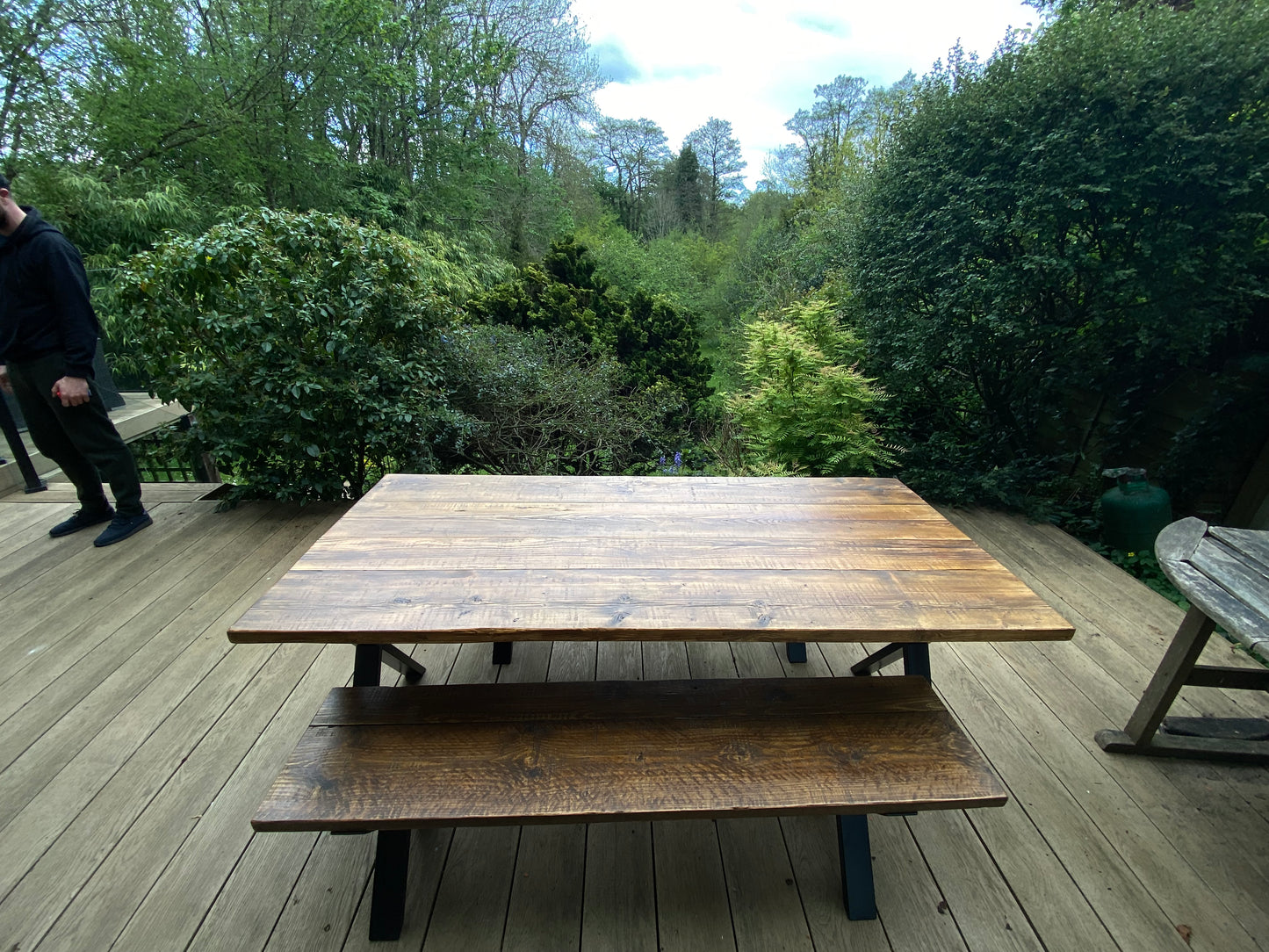 Handcrafted outdoor dining table made from reclaimed scaffold boards