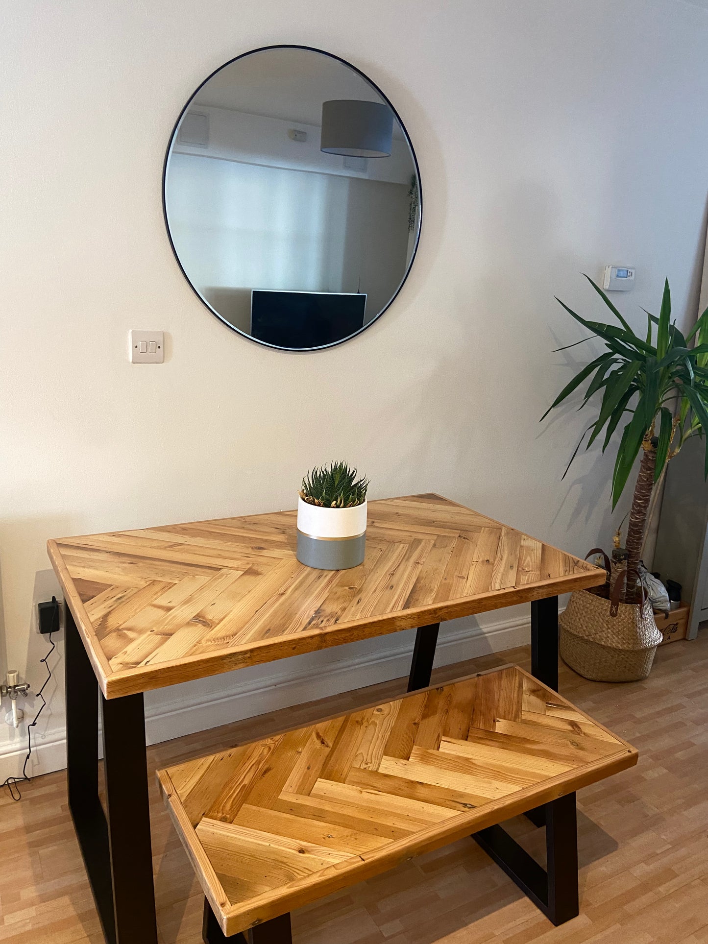 Handmade herringbone table crafted from reclaimed wood with metal legs, made to order in the UK