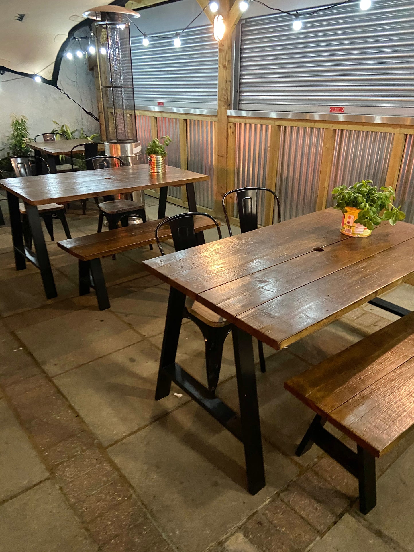 Handcrafted outdoor dining table made from reclaimed scaffold boards