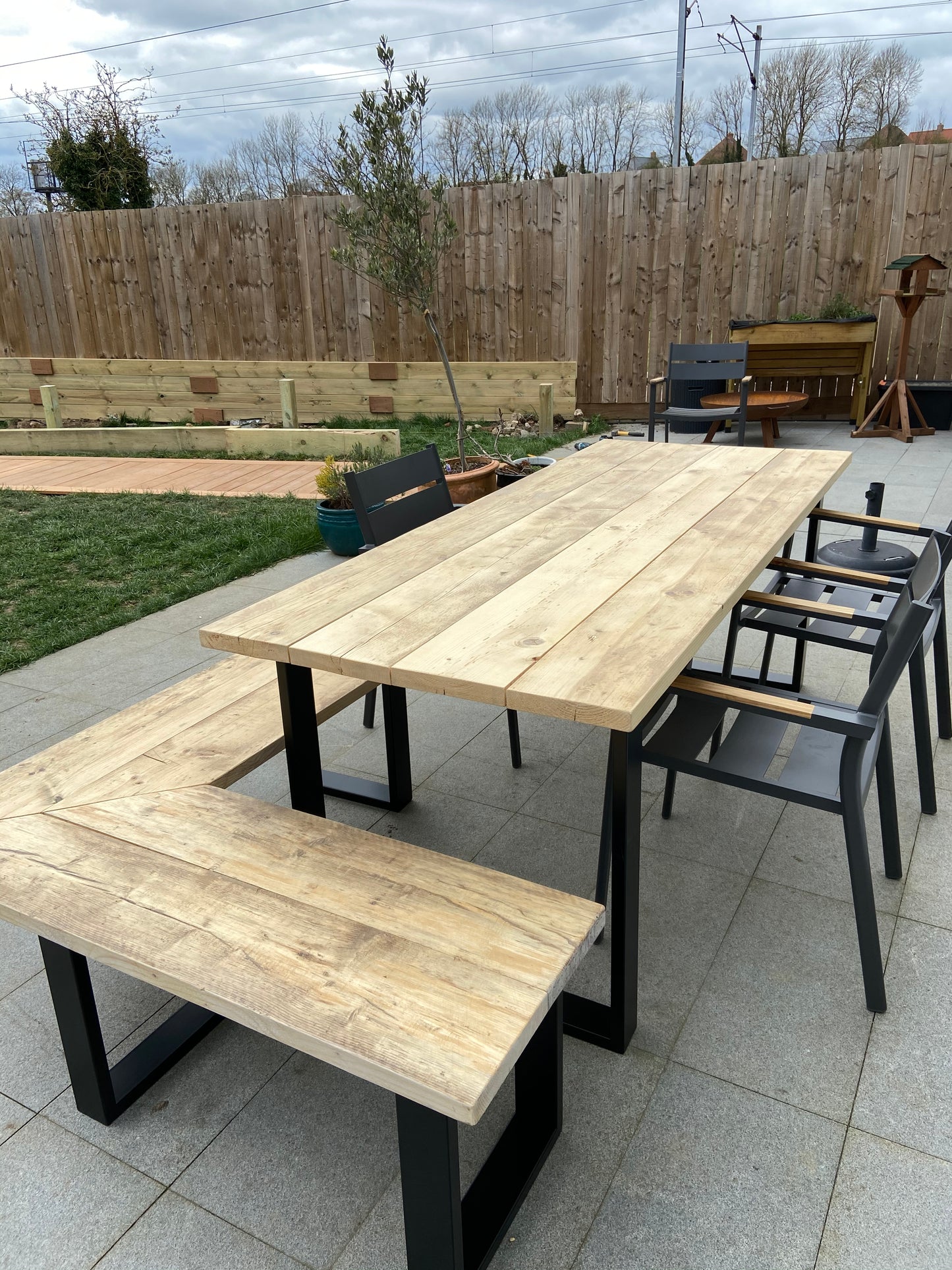 Handcrafted outdoor dining table made from reclaimed scaffold boards