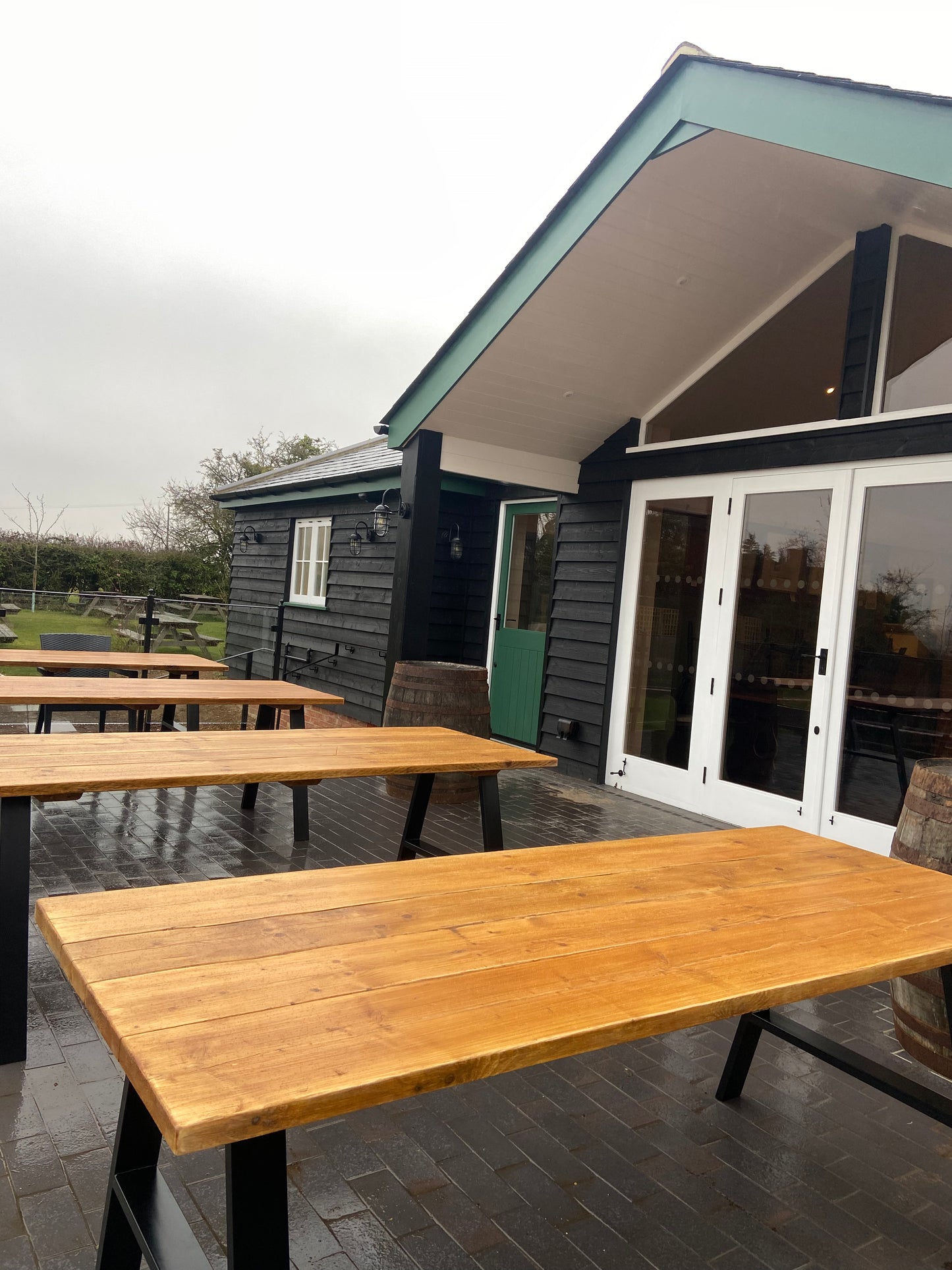 Handcrafted outdoor dining table made from reclaimed scaffold boards