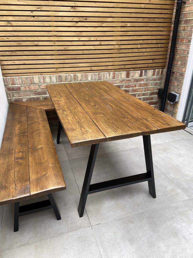 Handcrafted outdoor dining table made from reclaimed scaffold boards
