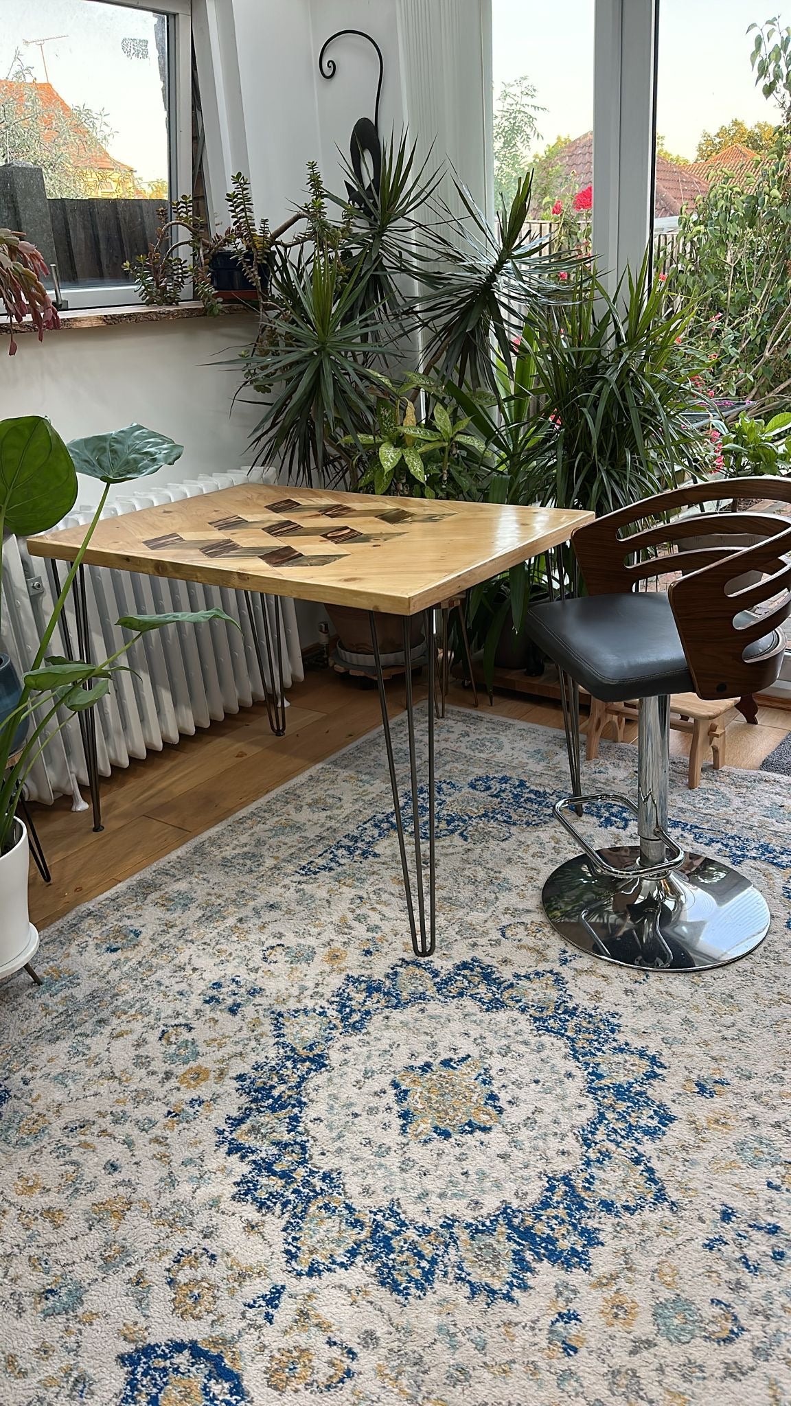 Reclaimed wood dining table with subtle 3D pattern top, handcrafted in the UK, finished with natural wax and showcasing rustic character details