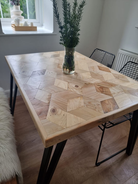 Handcrafted 3D reclaimed wood dining table with unique random pattern top, natural wax finish, and rustic character details like saw marks and paint traces
