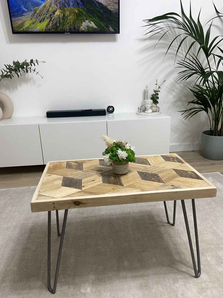 Handcrafted 3D reclaimed wood coffee table with block pattern top and black hairpin legs, rustic and modern design