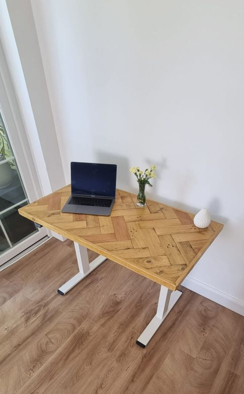 Adjustable height desk with reclaimed wood double herringbone top and electric legs, featuring LED smart handset with memory presets and child lock – handcrafted sit-stand desk for home or office.