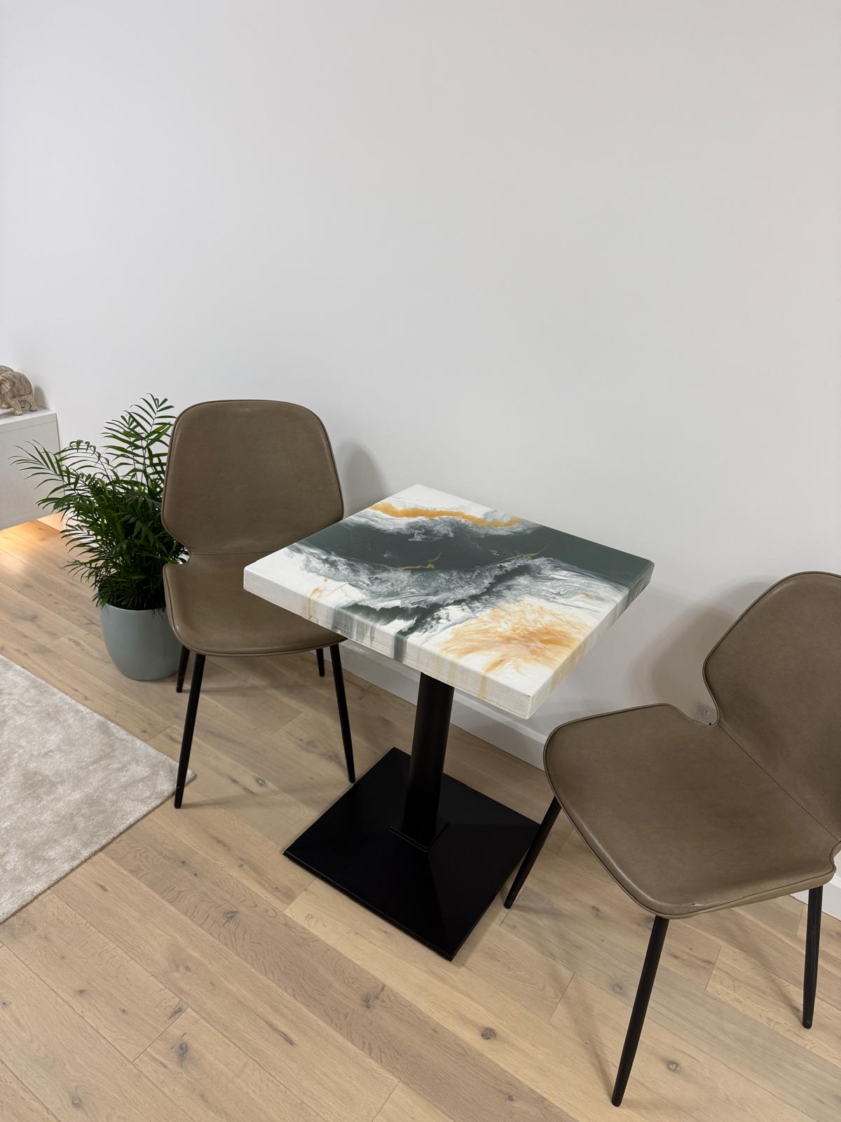 Handmade square epoxy resin dining table with artistic top and cast iron pedestal base – made to order in the UK.