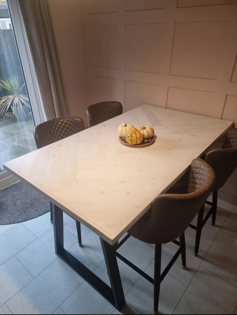 Handmade herringbone breakfast bar crafted from reclaimed wood with custom metal legs, made to order in the UK