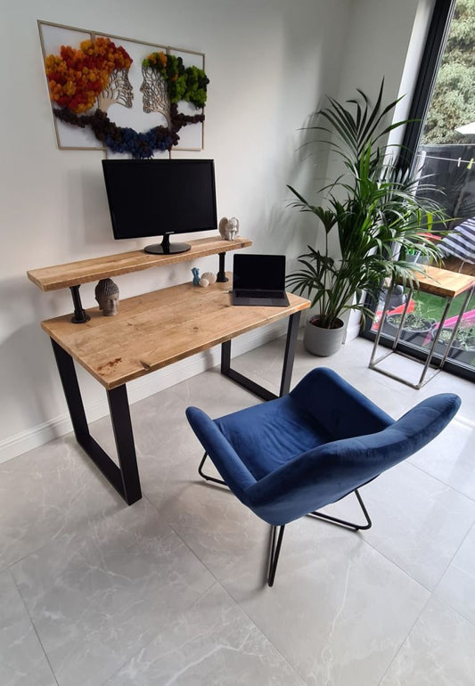 Handmade industrial desk with monitor shelf crafted from reclaimed wood and steel legs – rustic and modern workspace design.