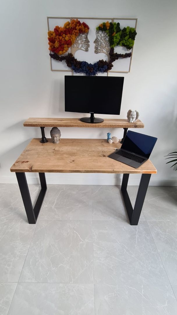 Handmade industrial desk with monitor shelf crafted from reclaimed wood and steel legs – rustic and modern workspace design.