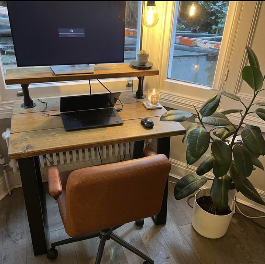 Handmade industrial desk with monitor shelf crafted from reclaimed wood and steel legs – rustic and modern workspace design.