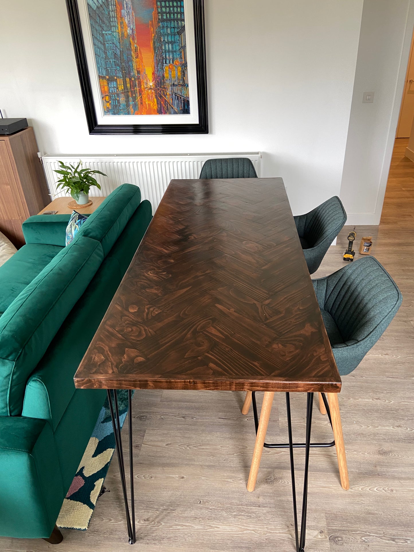 Handmade herringbone breakfast bar crafted from reclaimed wood with custom metal legs, made to order in the UK