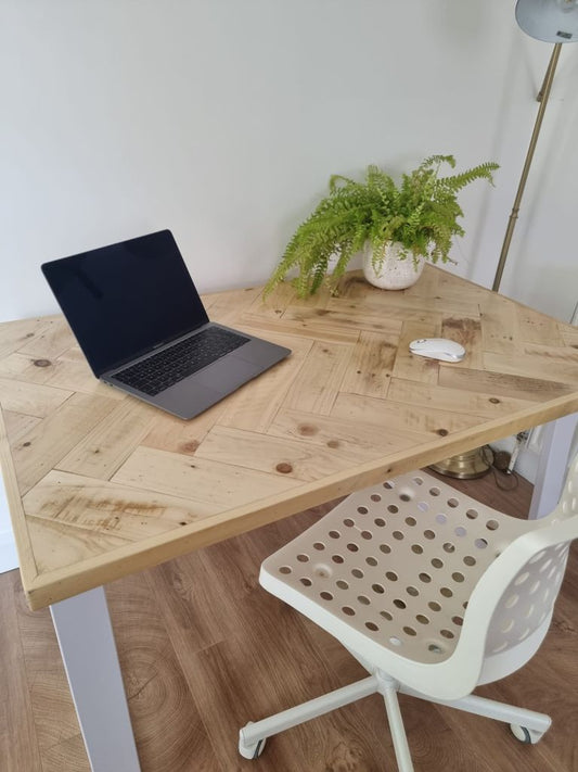 Handcrafted desk with double herringbone reclaimed wood top and industrial metal legs – rustic yet modern design for home office or workspace.