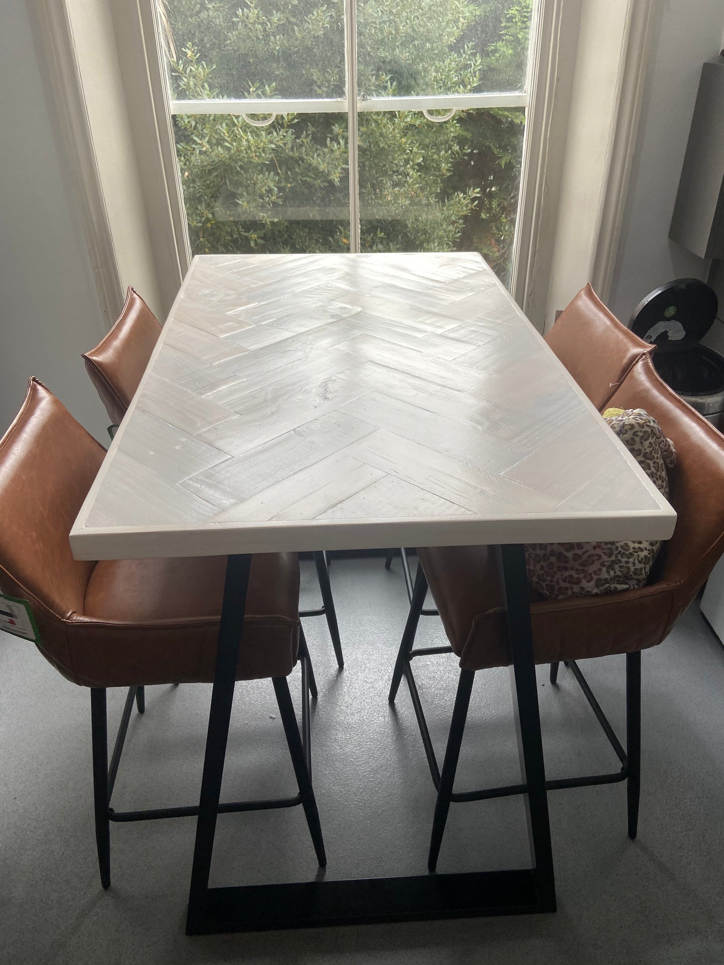 Handmade herringbone breakfast bar crafted from reclaimed wood with custom metal legs, made to order in the UK