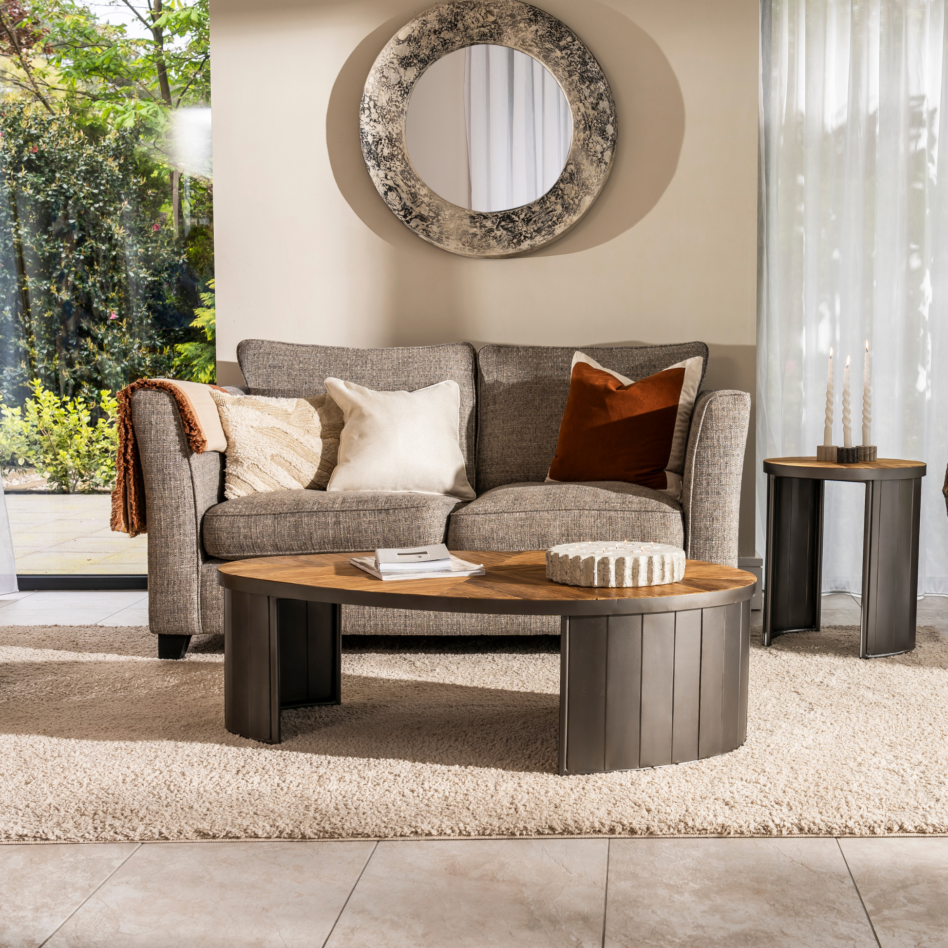 Egg-shaped reclaimed teak coffee table with pleated black metal base – Ironwood Series