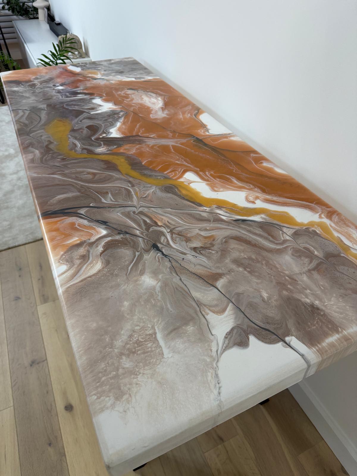Handmade epoxy resin dining table with colourful pouring art design and custom metal legs – made to order in the UK.