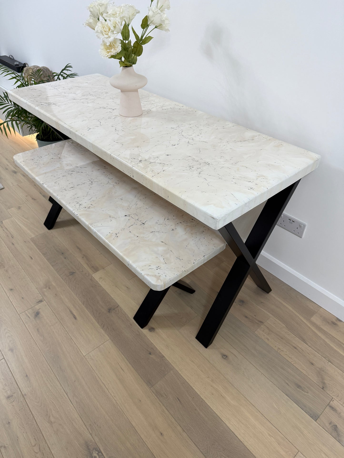 Handmade epoxy resin dining table with artistic marble effect top and custom metal legs – made to order in the UK, optional matching benches available.