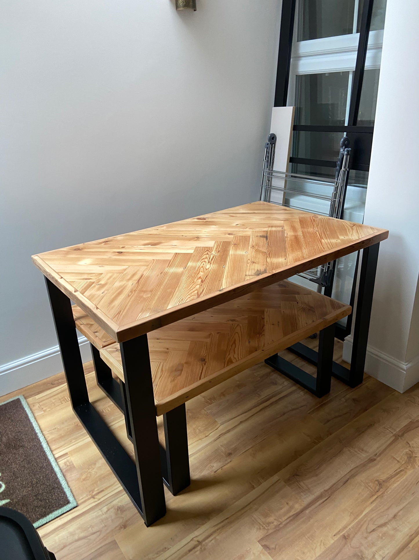 Handmade herringbone table crafted from reclaimed wood with metal legs, made to order in the UK