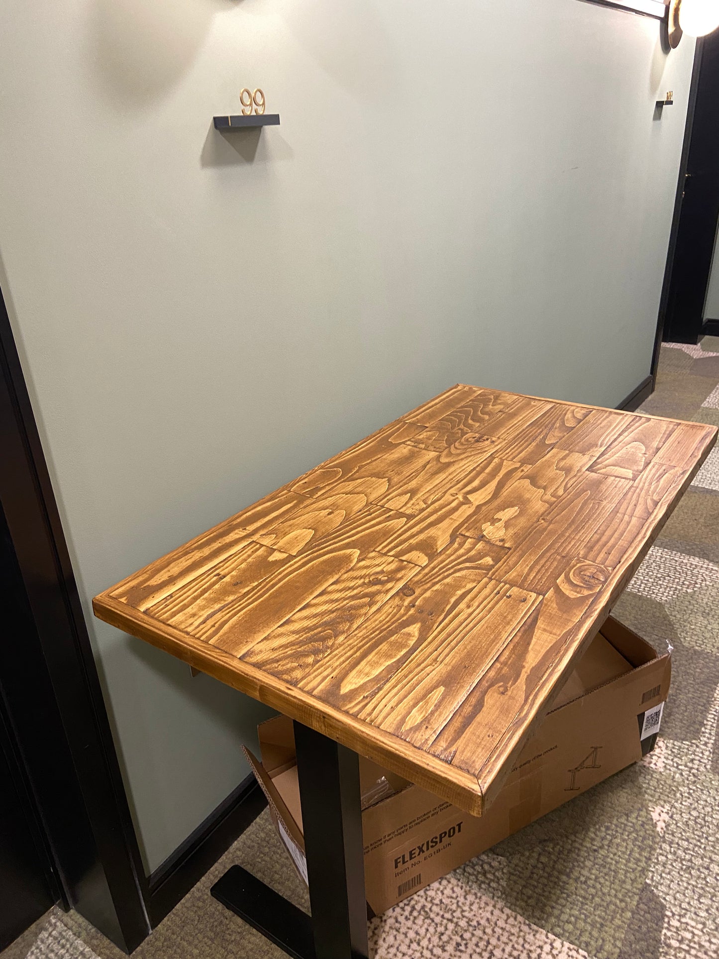 Adjustable height desk with reclaimed wood top and electric legs, featuring LED smart handset with memory presets and child lock – handcrafted sit-stand desk for home or office.