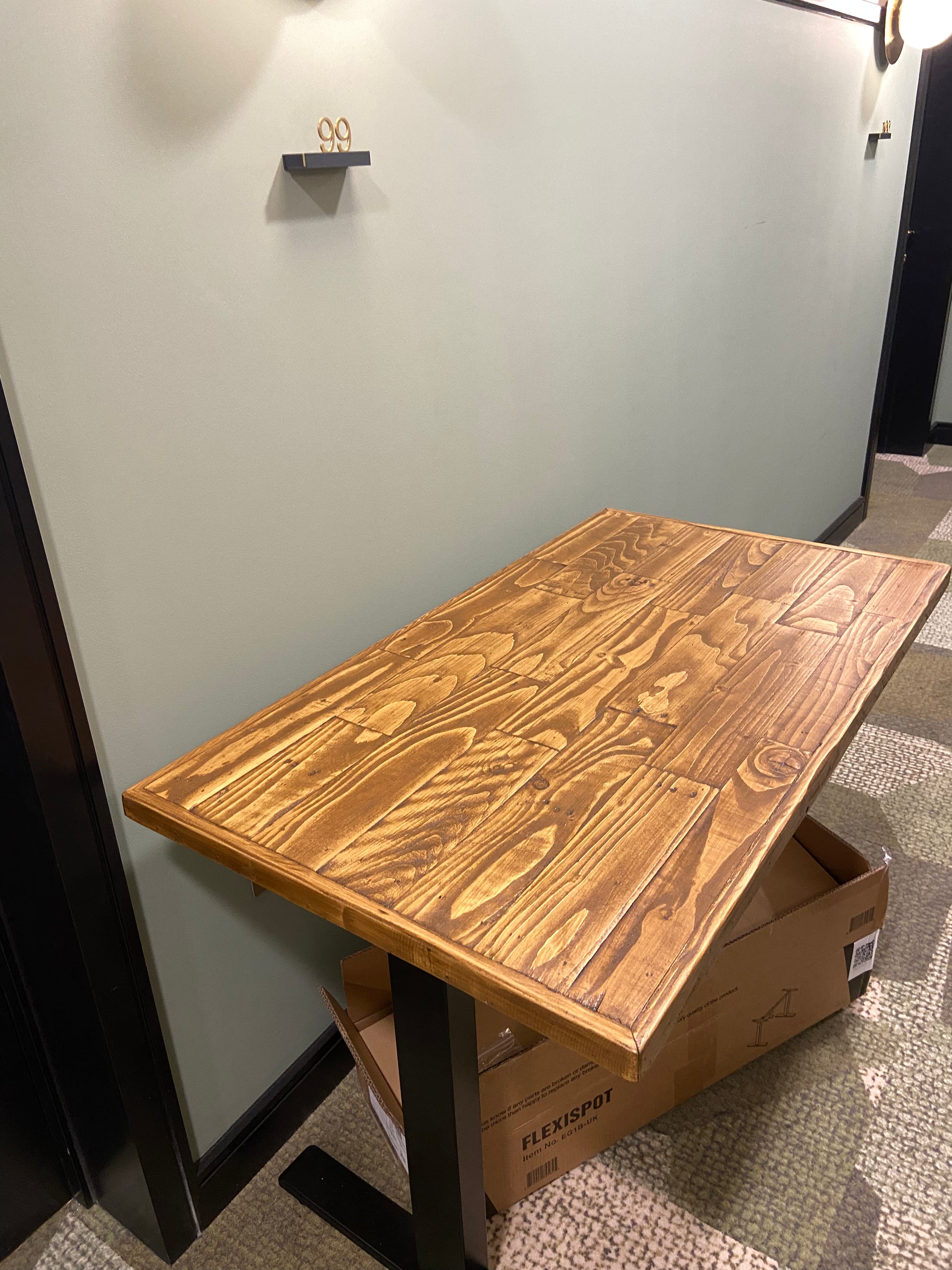 Adjustable height desk with reclaimed wood top and electric legs, featuring LED smart handset with memory presets and child lock – handcrafted sit-stand desk for home or office.