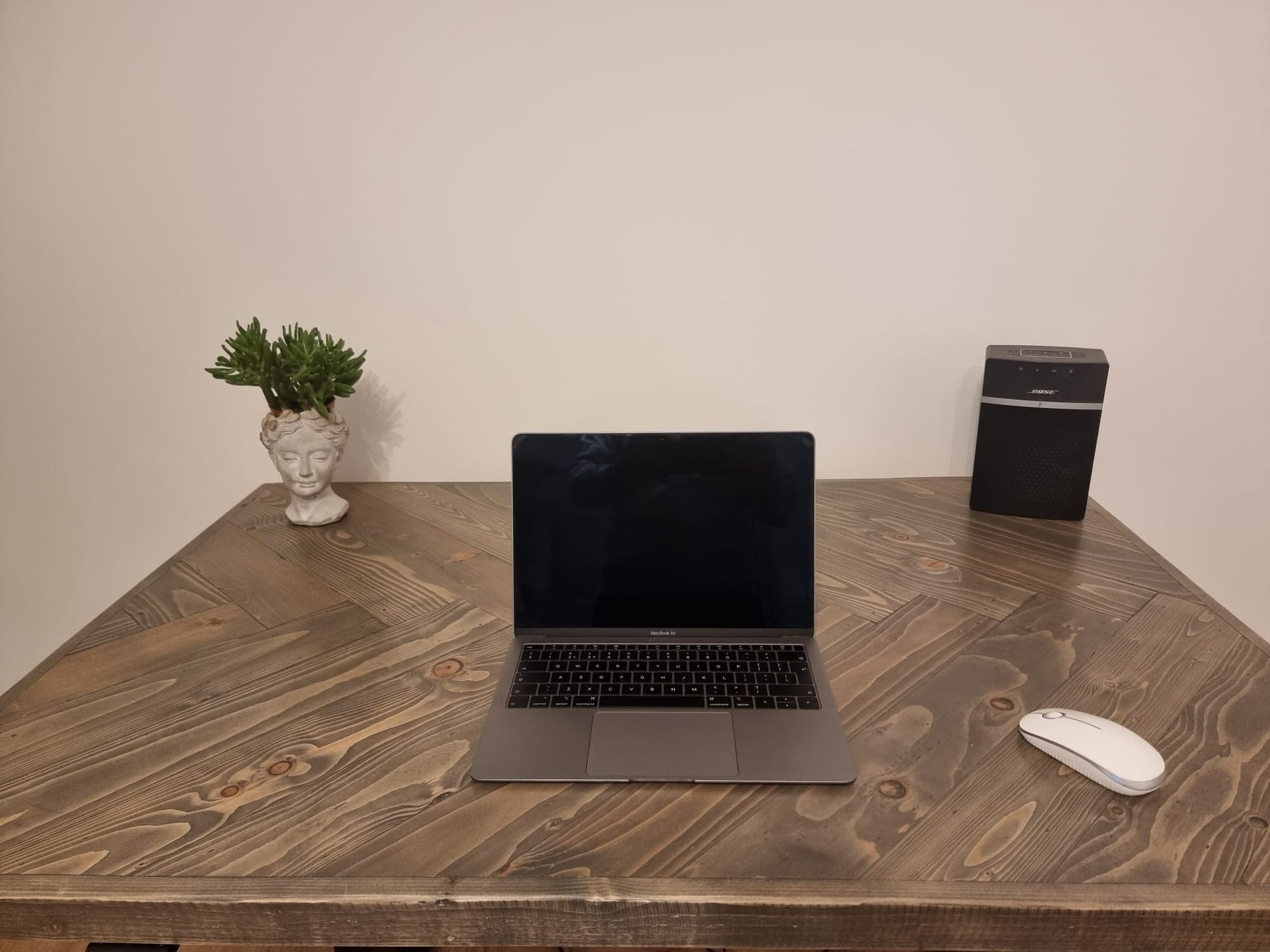 Adjustable height desk with reclaimed wood herringbone top and electric legs, featuring LED smart handset with memory presets and child lock – handcrafted sit-stand desk for home or office.