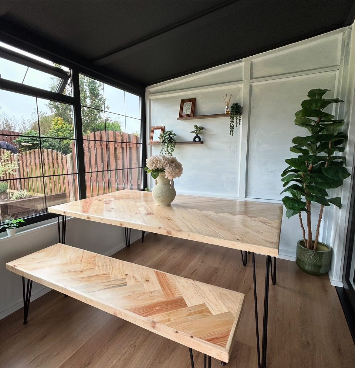 Handcrafted herringbone dining table made from reclaimed wood