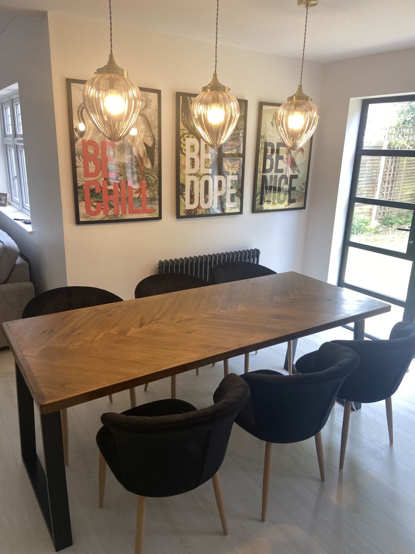 Handcrafted herringbone dining table made from reclaimed wood