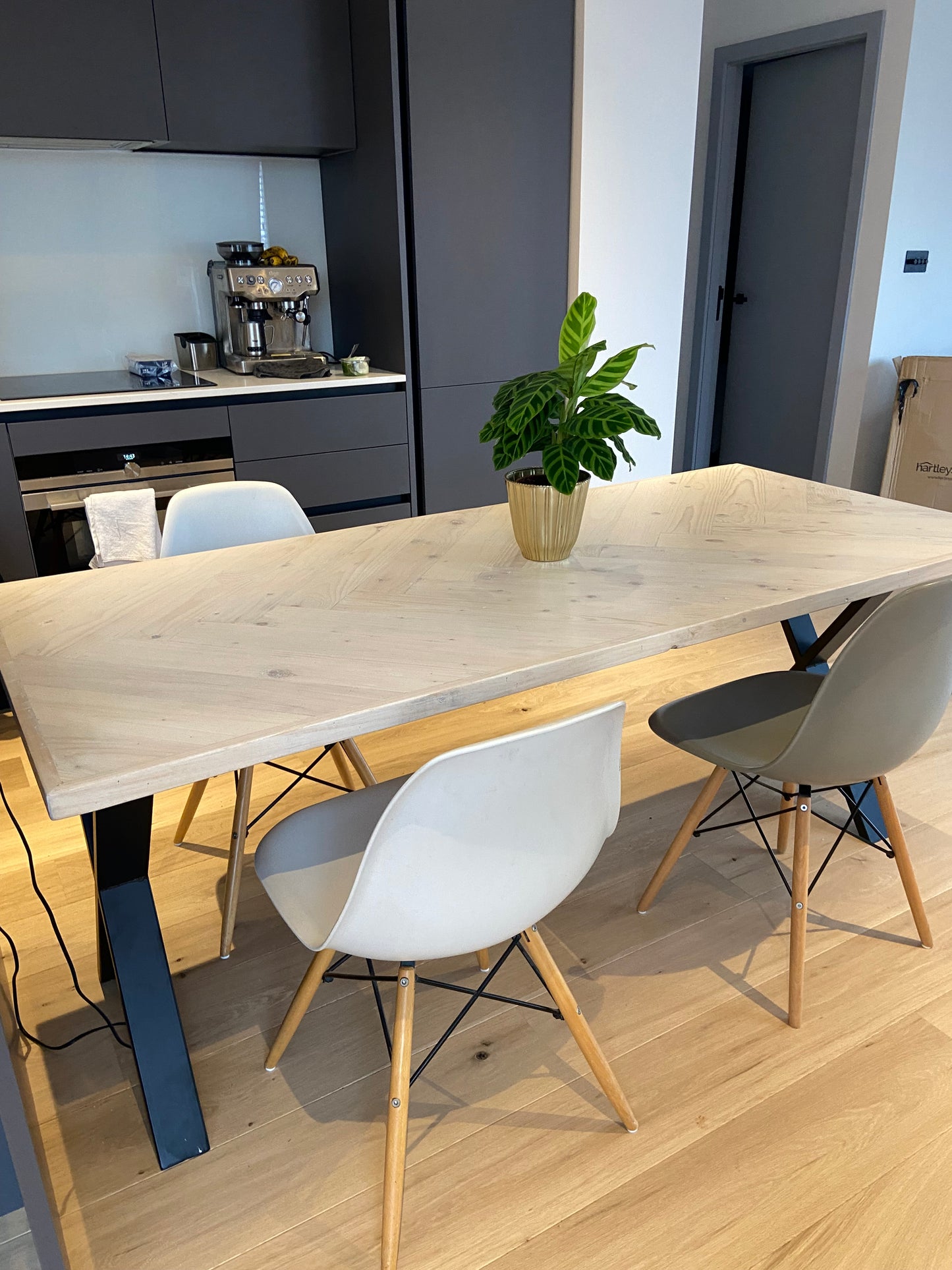 Handcrafted Herringbone Dining Table with Reclaimed Wood and Custom Legs - The Rough Wood UK
