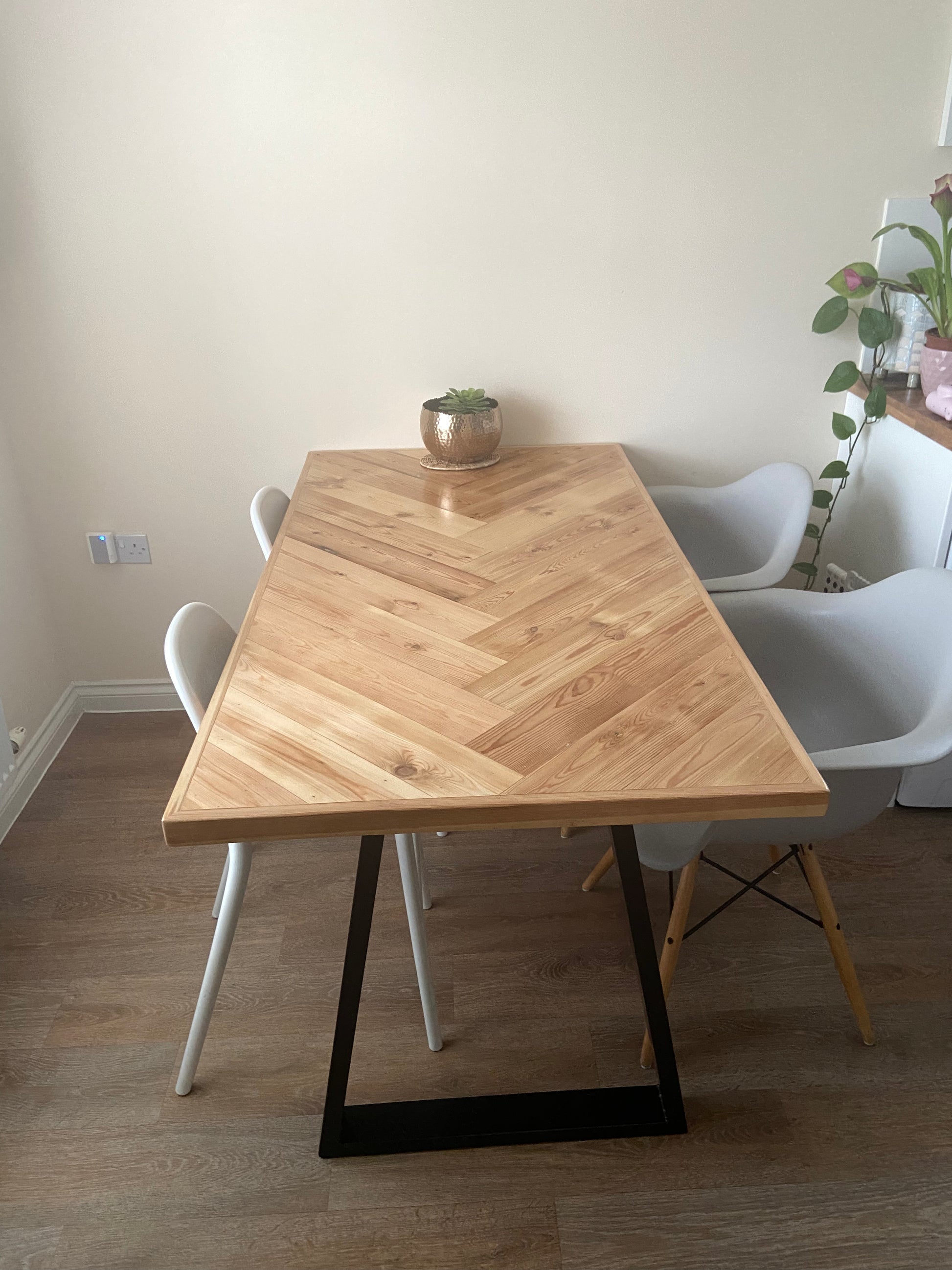 Handmade herringbone table crafted from reclaimed wood with metal legs, made to order in the UK