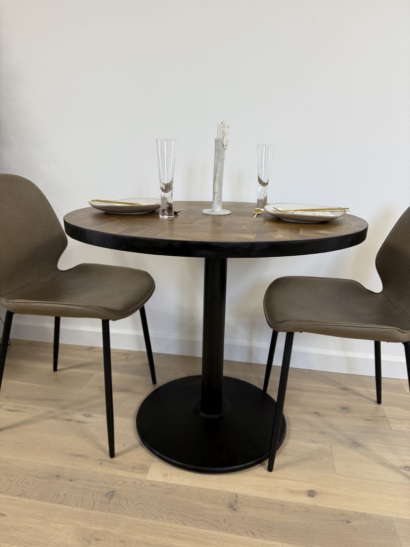 Handmade round reclaimed wood dining table with double herringbone pattern, smooth sanded top, and natural wax finish – rustic and elegant UK craftsmanship