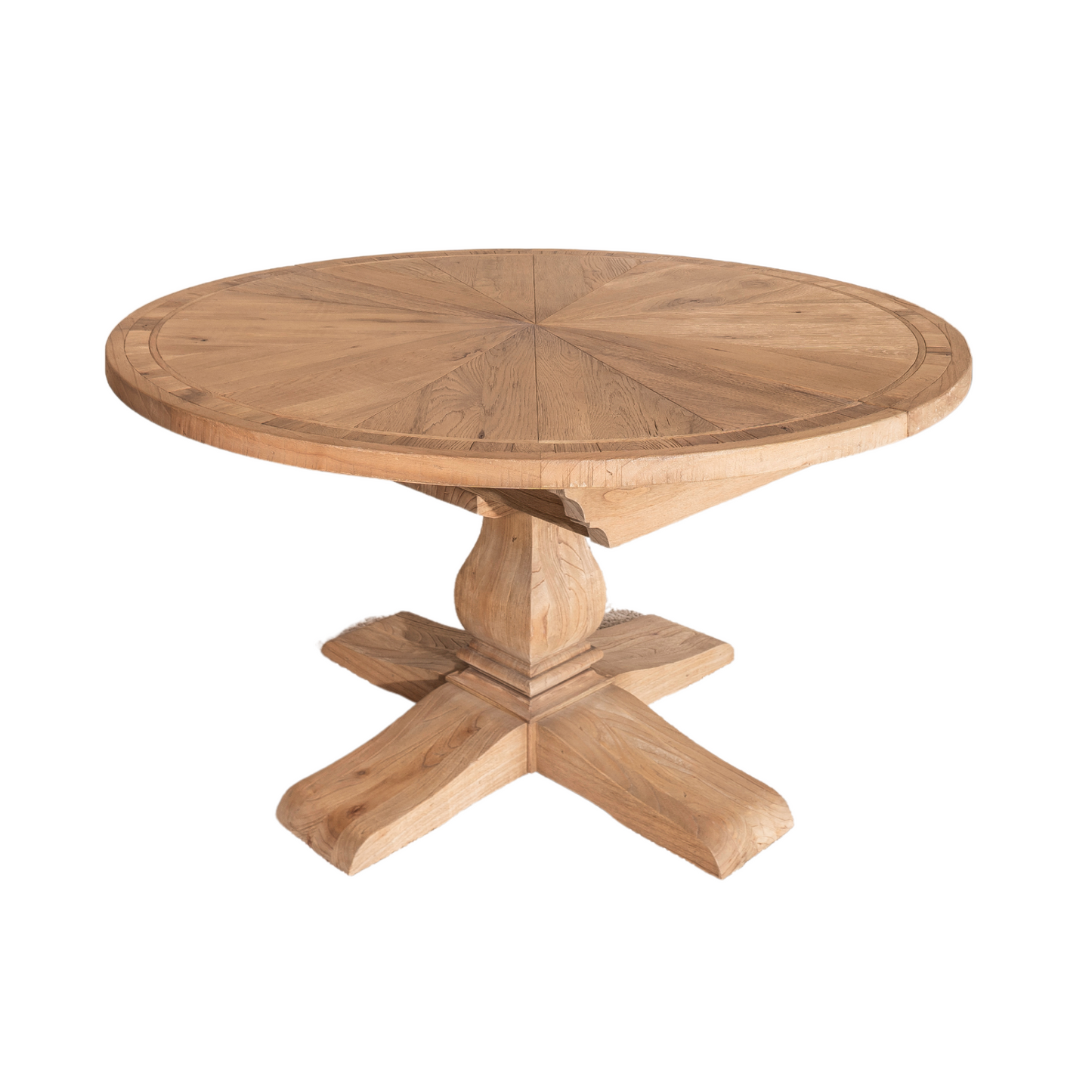Round solid oak extending dining table in classic farmhouse style, styled in a bright dining area. Part of the Elmstead Series by TheRoughWood.