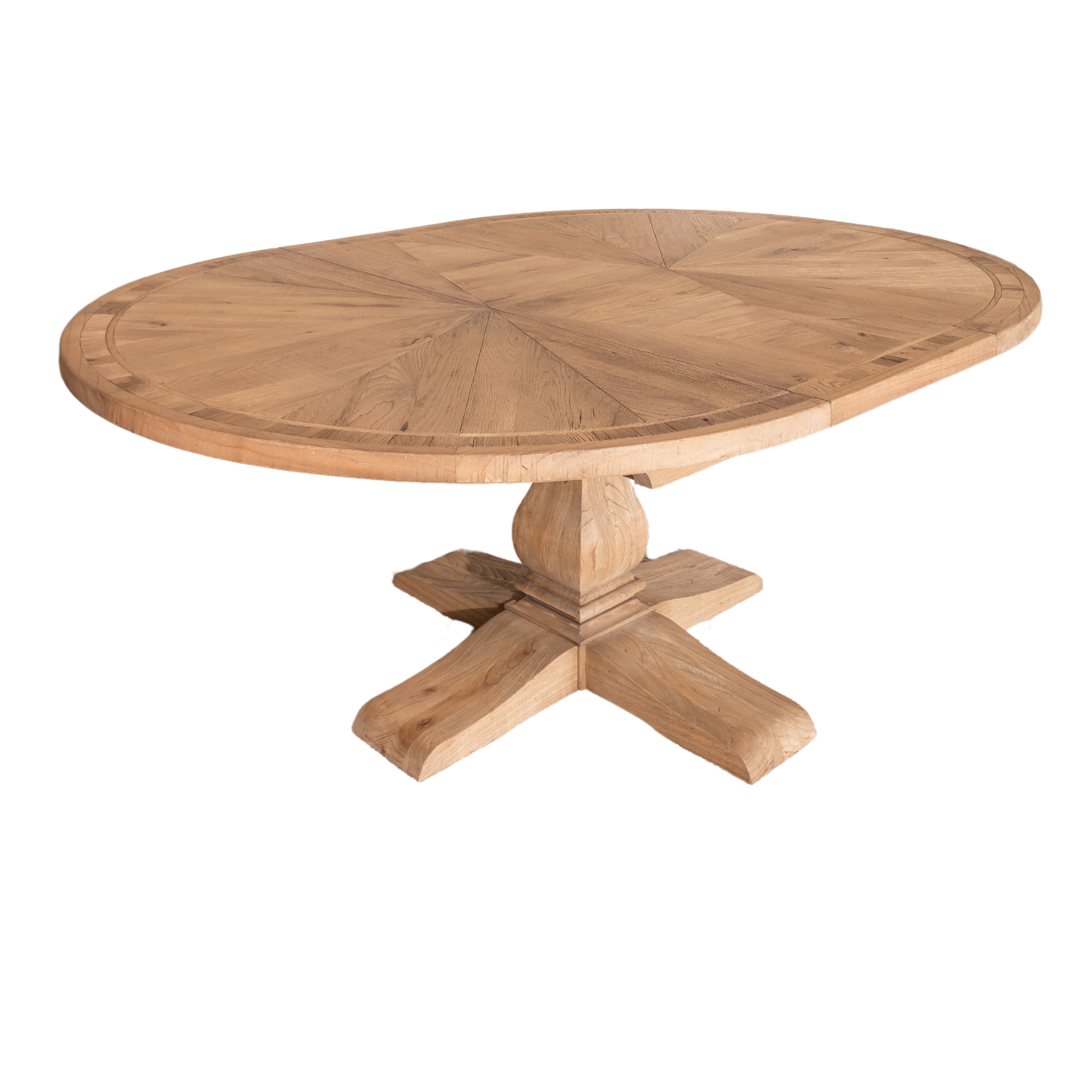 Round solid oak extending dining table in classic farmhouse style, styled in a bright dining area. Part of the Elmstead Series by TheRoughWood.