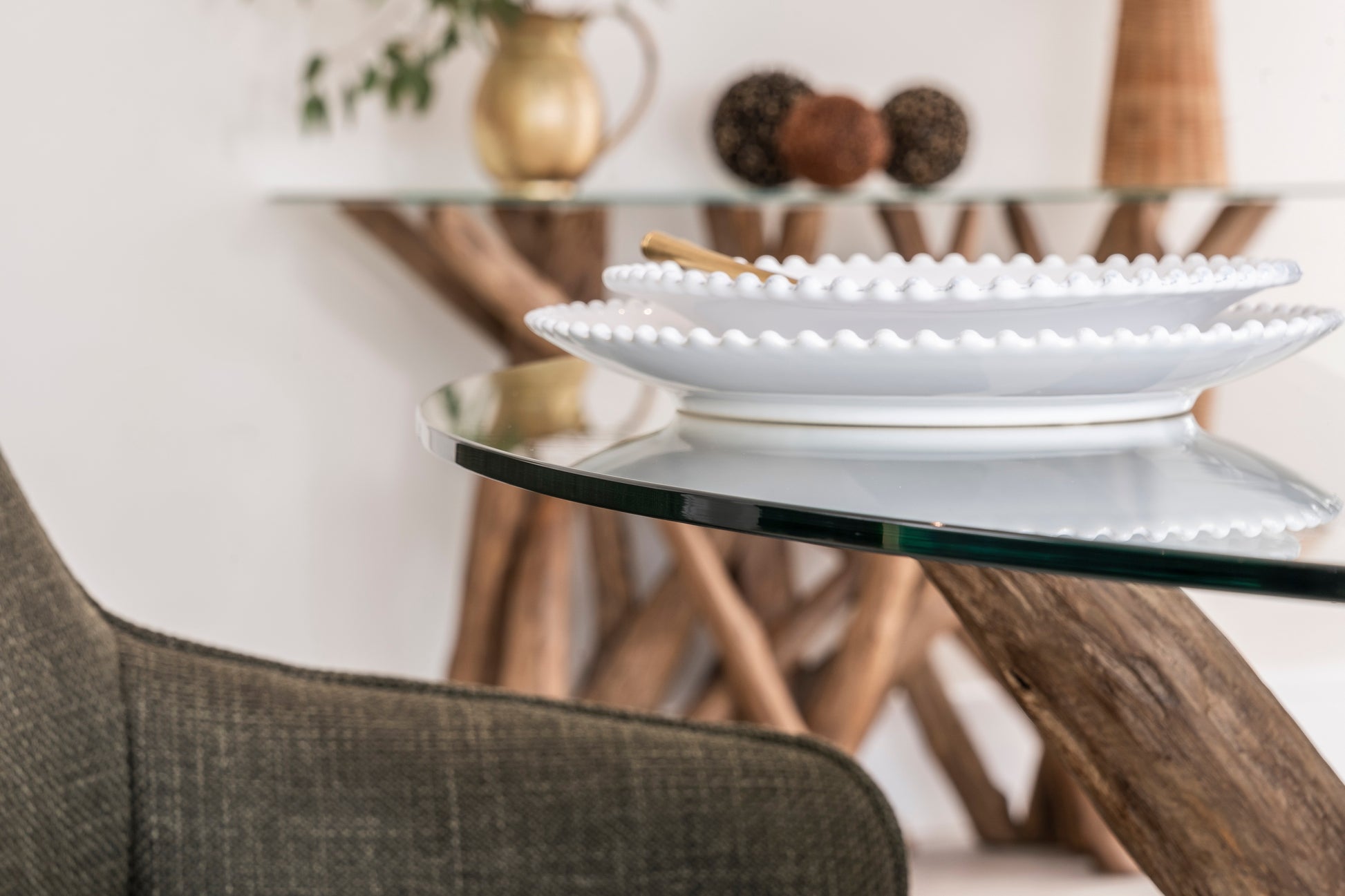 Round teak root dining table with tempered glass top – handcrafted wood base from the Branchwood Series, each piece uniquely shaped by nature