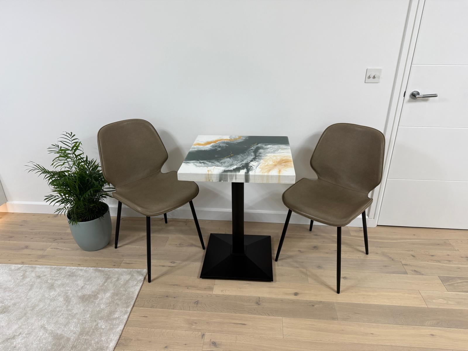 Handmade square epoxy resin dining table with artistic top and cast iron pedestal base – made to order in the UK.