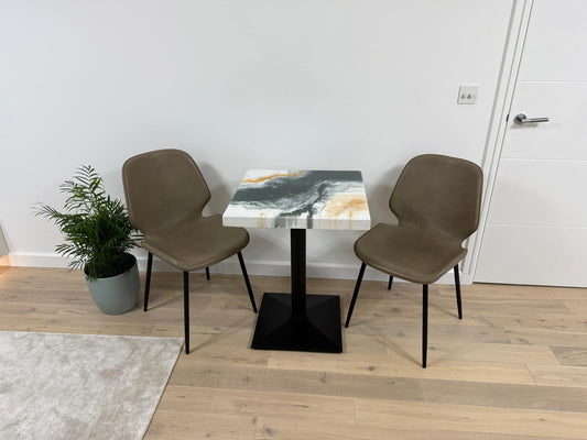 Handmade square epoxy resin dining table with artistic top and cast iron pedestal base – made to order in the UK.