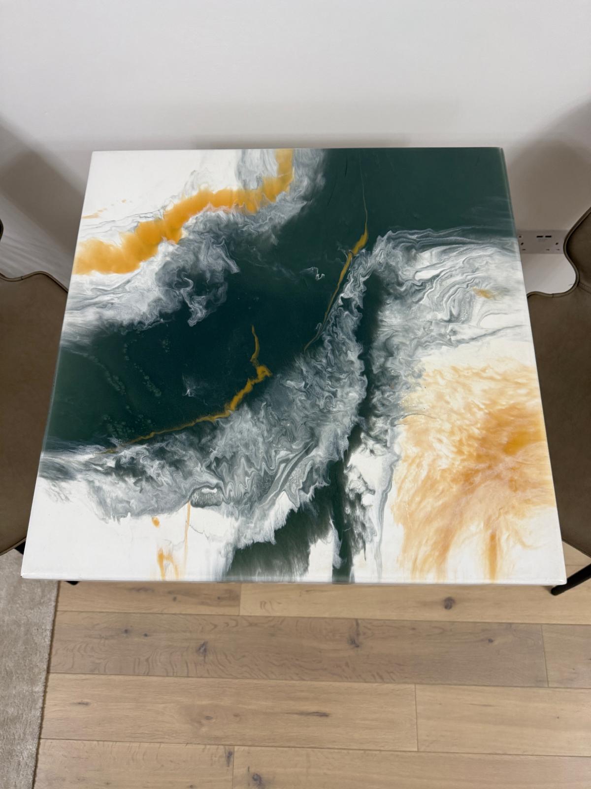 Handmade square epoxy resin dining table with artistic top and cast iron pedestal base – made to order in the UK.
