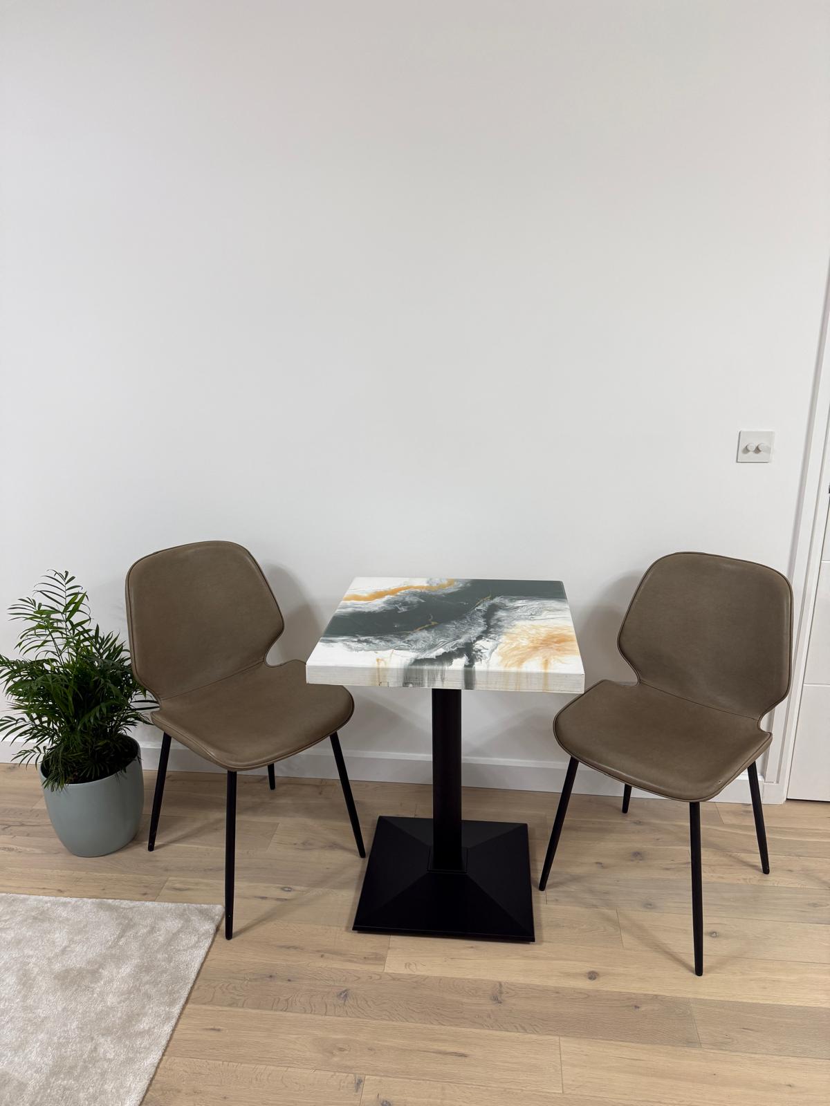Handmade square epoxy resin dining table with artistic top and cast iron pedestal base – made to order in the UK.