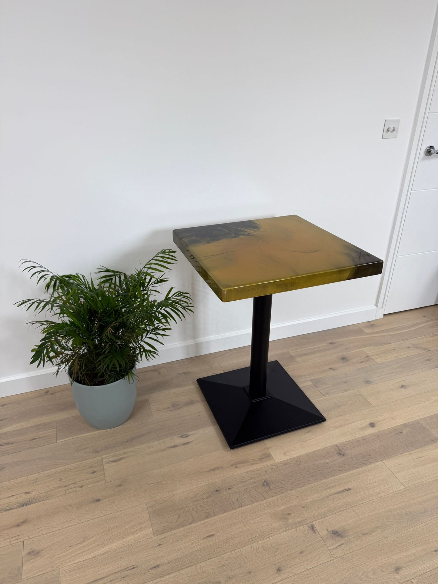 Handmade square epoxy resin dining table with artistic resin top and custom metal base – made to order in the UK.
