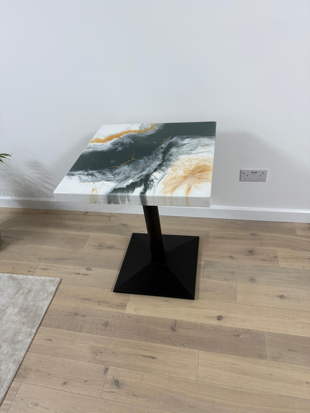 Handmade square epoxy resin dining table with artistic top and cast iron pedestal base – made to order in the UK.