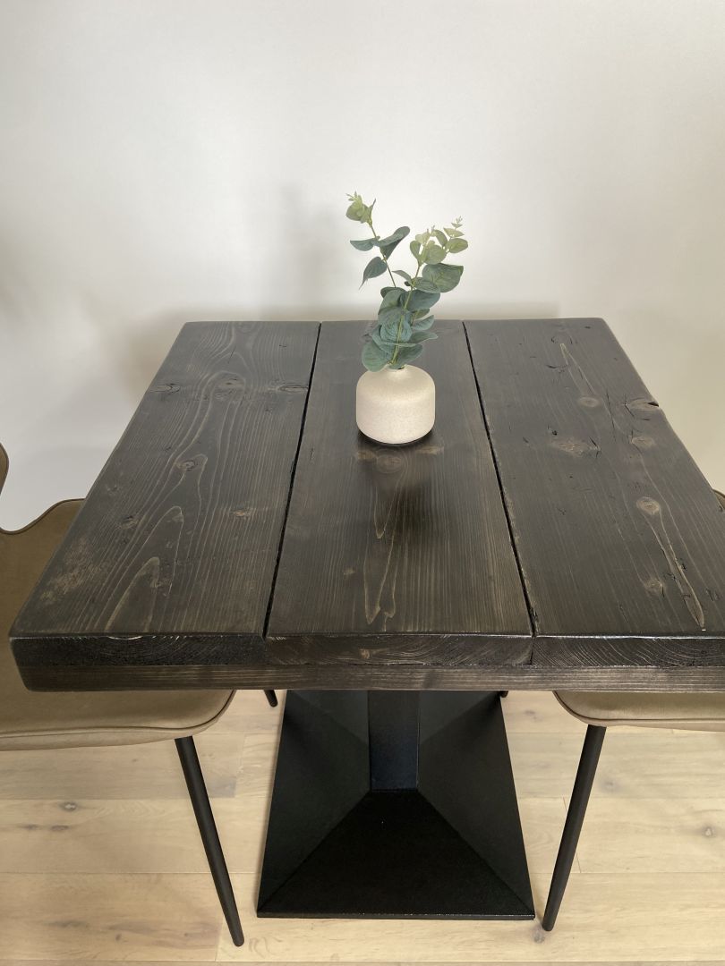 Square bistro table with reclaimed scaffold board top and black cast iron pedestal base, handcrafted in the UK with a smooth wax finish