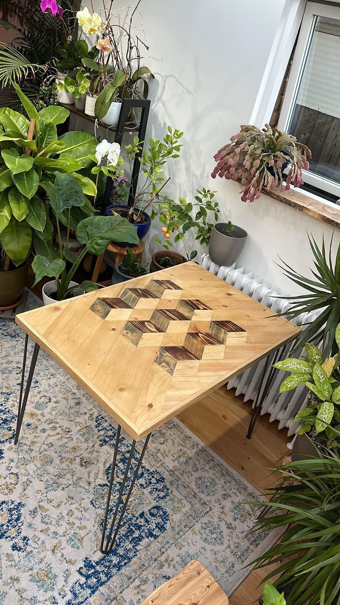 Reclaimed wood dining table with subtle 3D pattern top, handcrafted in the UK, finished with natural wax and showcasing rustic character details
