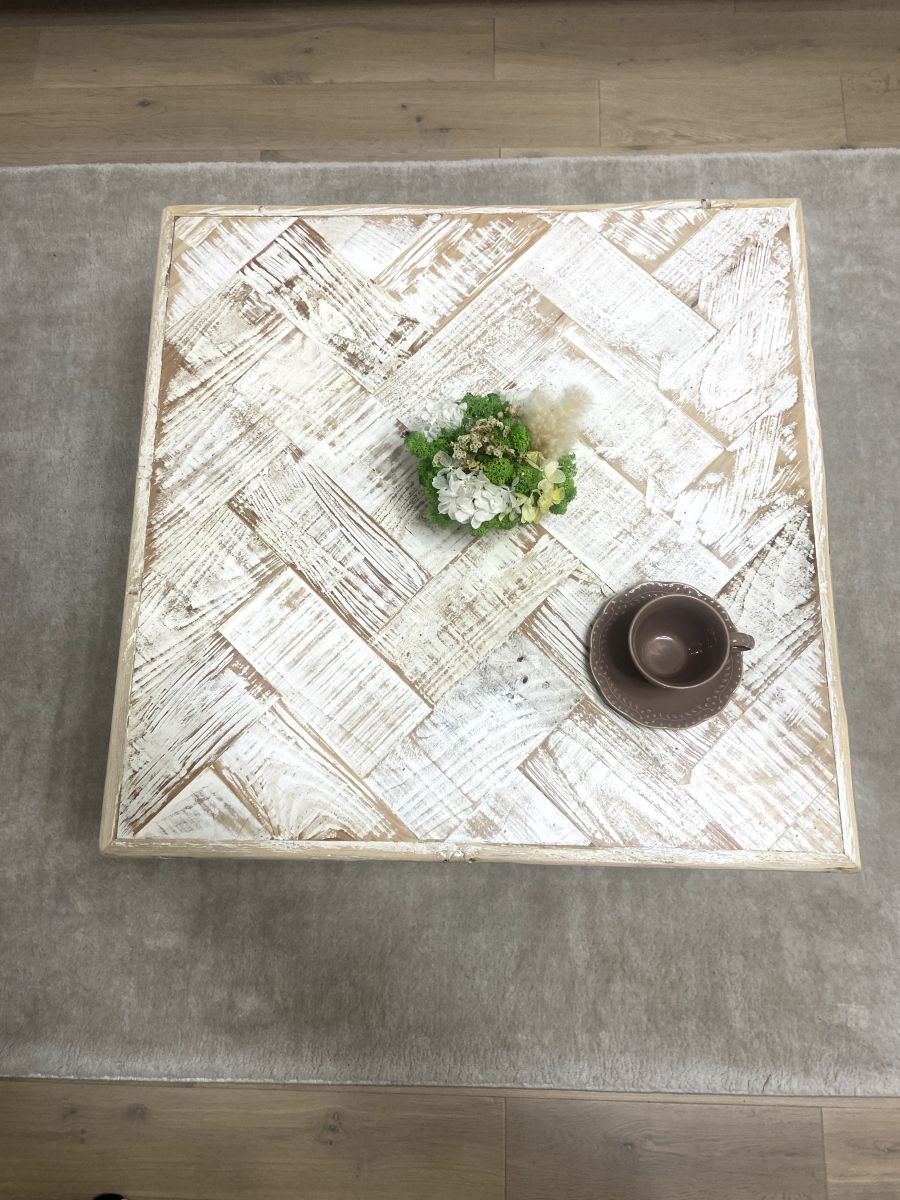 Handmade double herringbone coffee table with distressed reclaimed wood top and metal legs – rustic and bold living room centerpiece