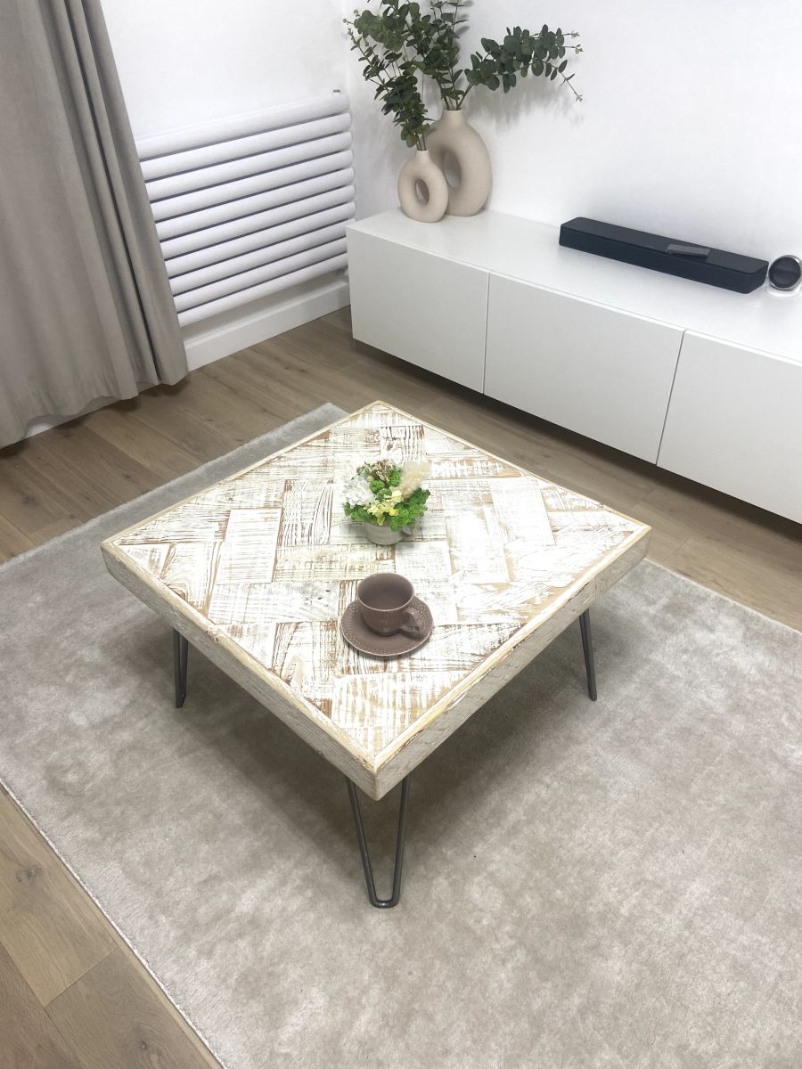 Handmade double herringbone coffee table with distressed reclaimed wood top and metal legs – rustic and bold living room centerpiece