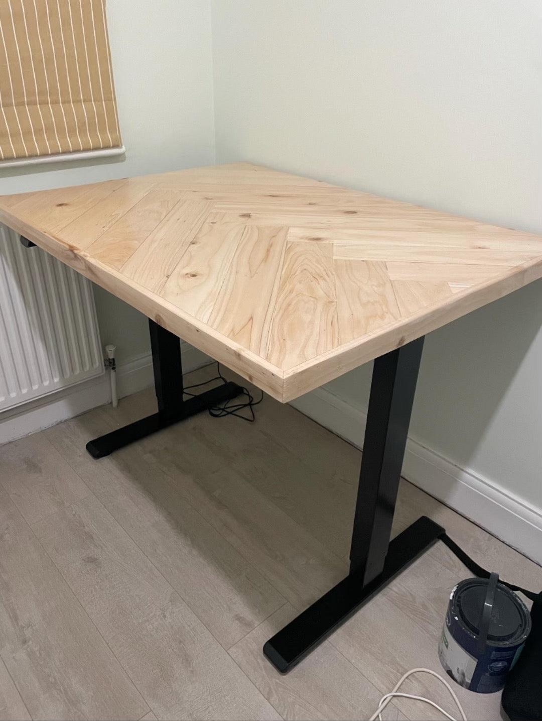 Adjustable height desk with reclaimed wood herringbone top and electric legs, featuring LED smart handset with memory presets and child lock – handcrafted sit-stand desk for home or office.