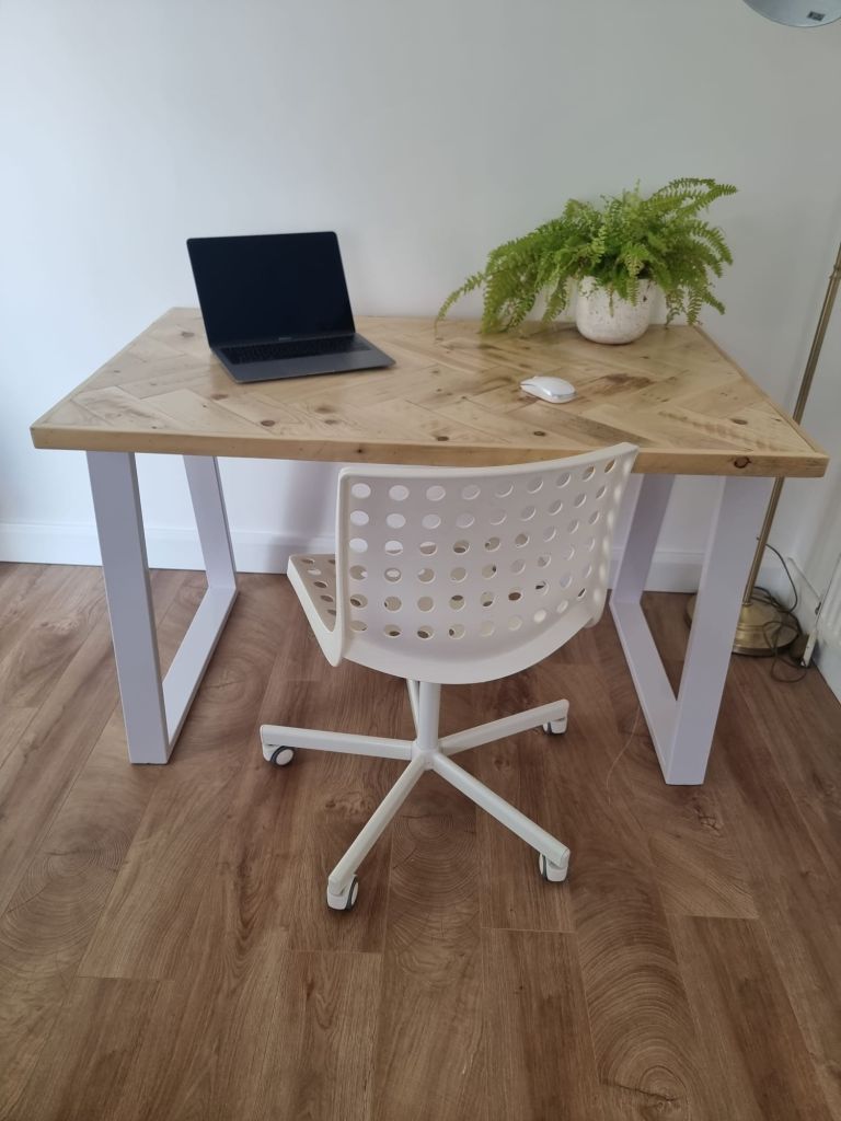Handcrafted desk with double herringbone reclaimed wood top and industrial metal legs – rustic yet modern design for home office or workspace.