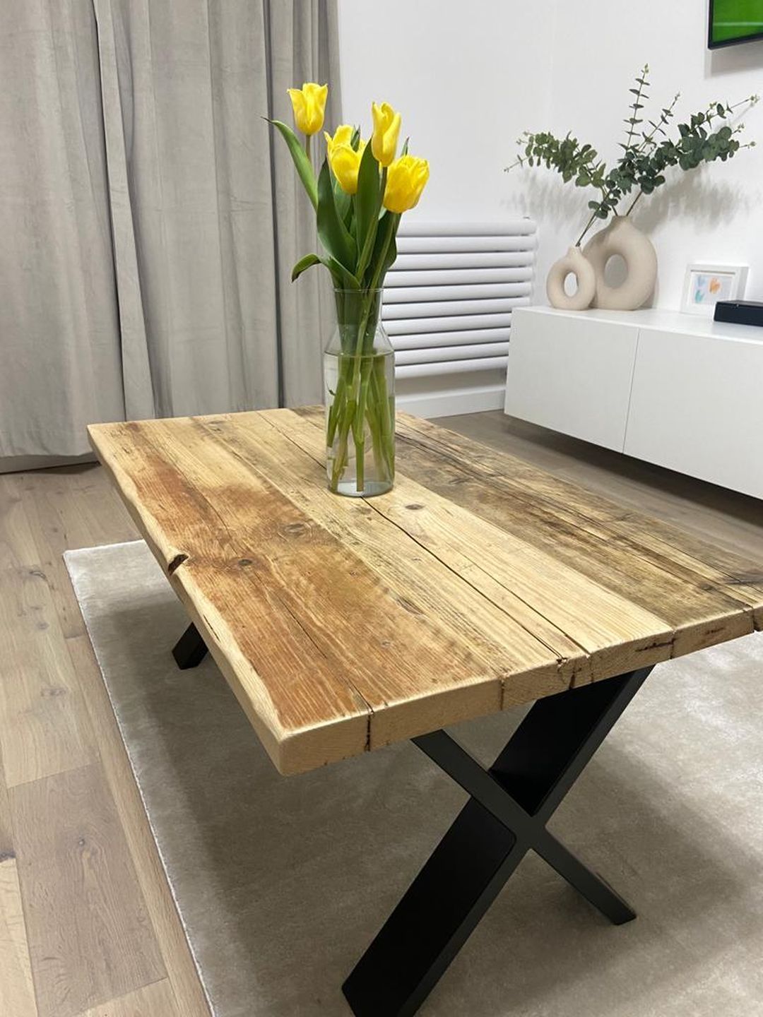Handmade coffee table crafted from reclaimed scaffold boards with a rustic wood top and metal legs – sustainable and full of character.