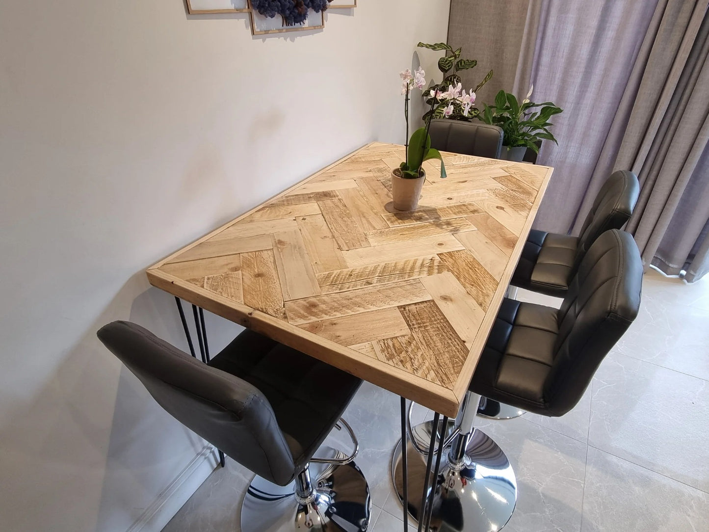 Handmade herringbone breakfast bar crafted from reclaimed wood with custom metal legs, made to order in the UK